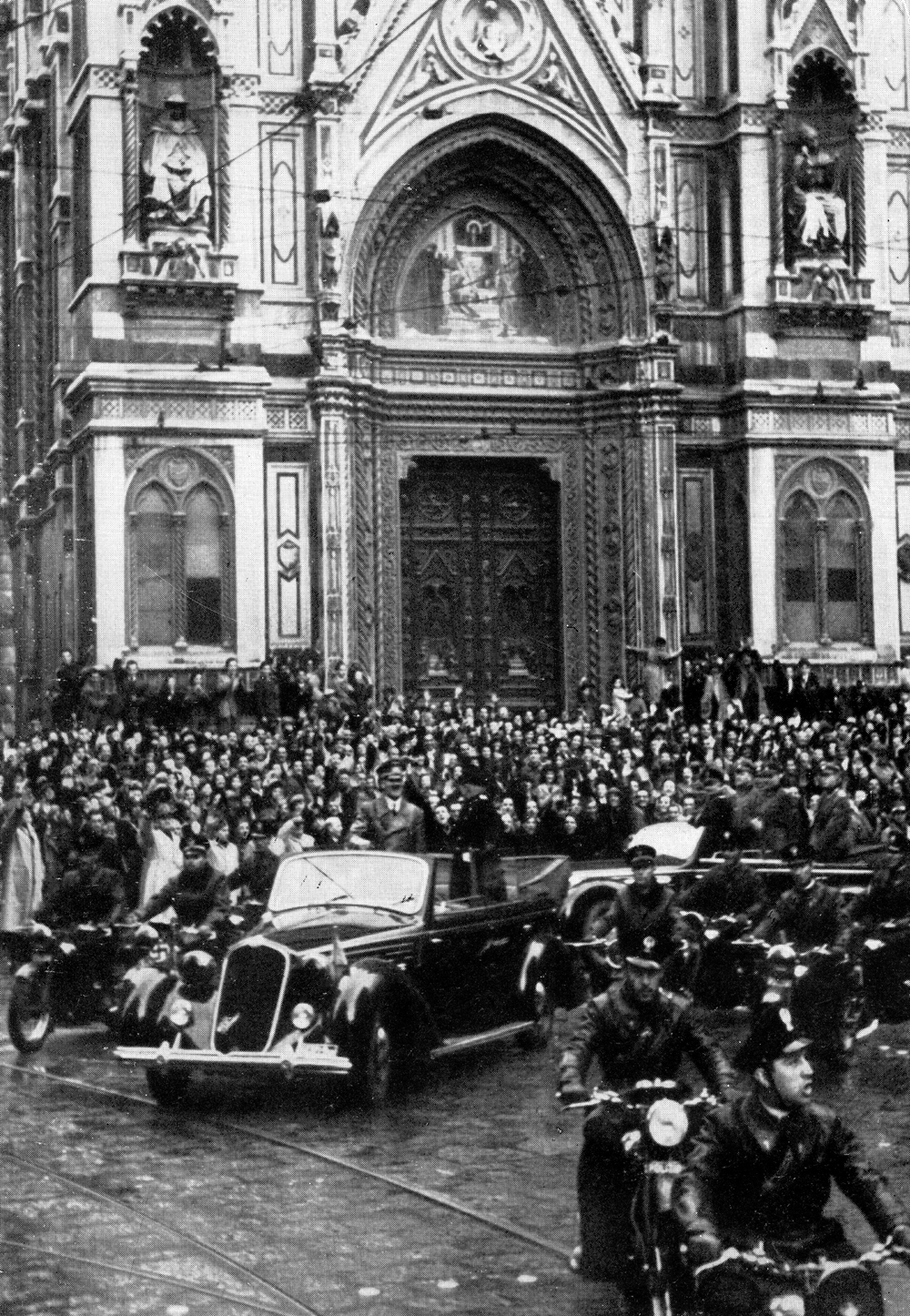 Adolf Hitler and Benito Mussolini are welcomed by the crowd in front of the cathedral of Florence